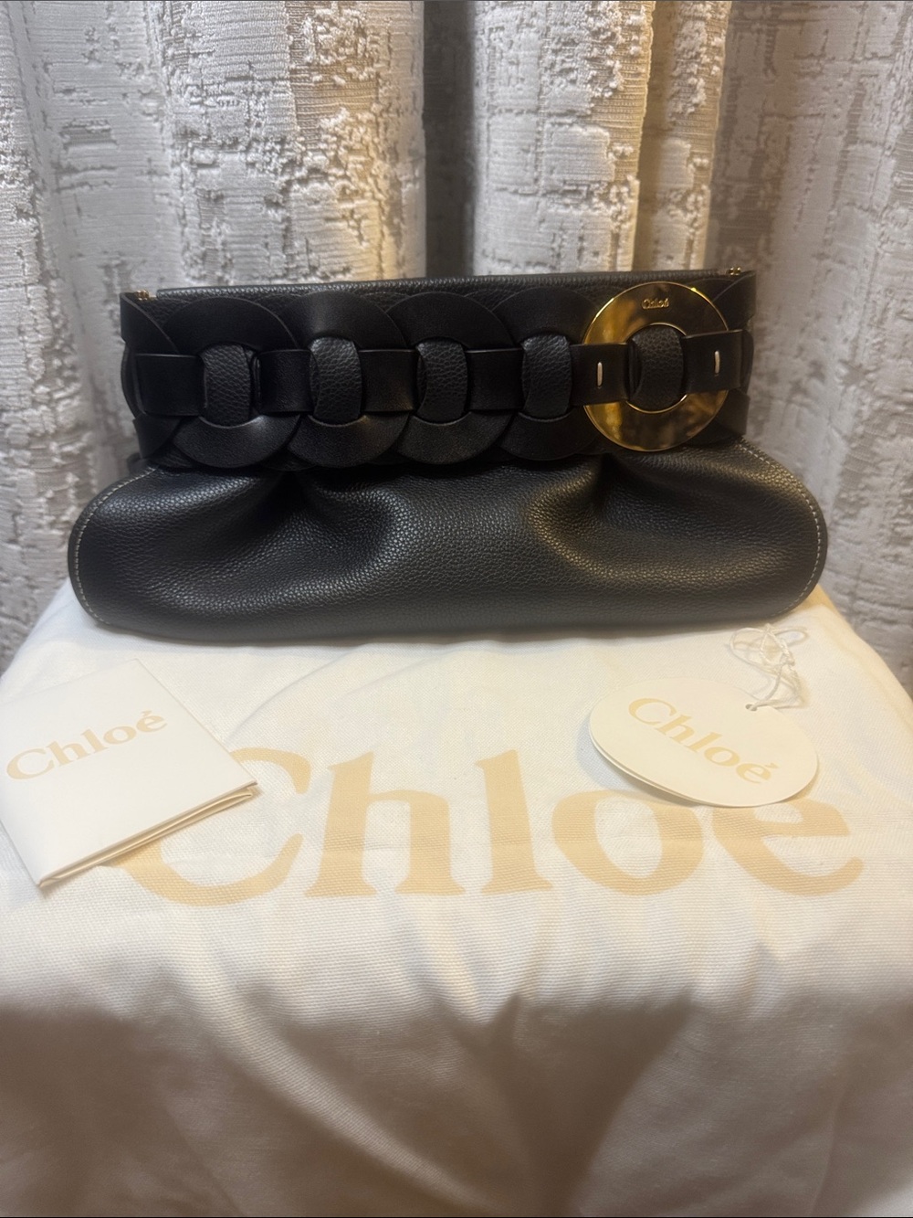Chloรฉ Black Pebbled Leather Clutch with Gold Disc Accent BRAND NEW with tags